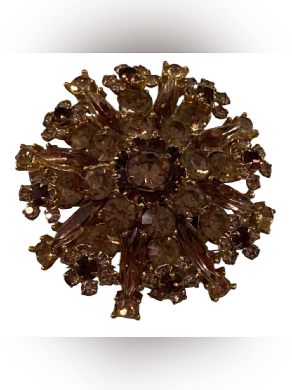 Crystal brooch with gold tone backing. Pre owned All the stones are intact